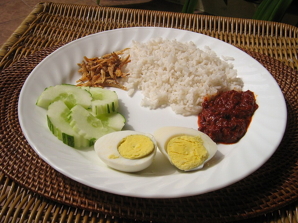 Nasi lemak in its basic form: coconut rice with sambal, fried anchovies, cucumber and boiled egg